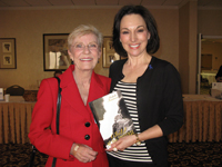 Michele presents her book "Child of the Universe" to Actor/Author; Patty Duke, also an adult survivor of abuse.